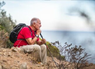 What Give Us Purpose After Work? Man looking out from a hill with a contemplative look